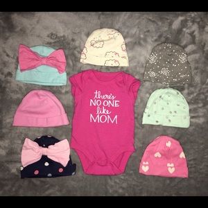 7 hats and 1 short-sleeve Bodysuit